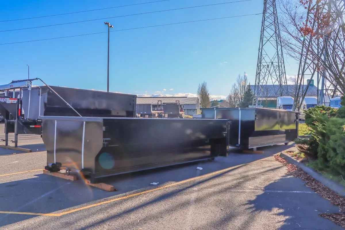 Roll-off dumpster ready for waste disposal at job site for 3 Yard Dumpster Rental in Algoma